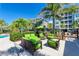 Green patio furniture near the community pool at 391 Aruba Cir # 302, Bradenton, FL 34209