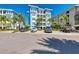 Three-story building with parking and tropical landscaping at 391 Aruba Cir # 302, Bradenton, FL 34209