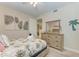 Guest bedroom with dresser and queen-size bed at 391 Aruba Cir # 302, Bradenton, FL 34209