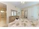 Bright bedroom with dresser and queen-size bed at 391 Aruba Cir # 302, Bradenton, FL 34209