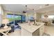 Open concept kitchen with island and views to living room at 391 Aruba Cir # 302, Bradenton, FL 34209
