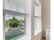 Bedroom with serene water views and natural light at 391 Aruba Cir # 302, Bradenton, FL 34209