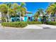 Community building with palm trees and landscaping at 391 Aruba Cir # 302, Bradenton, FL 34209