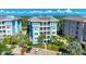 Luxury condo building with water views and palm trees at 391 Aruba Cir # 302, Bradenton, FL 34209