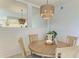 Light and airy dining room with round table and chairs at 391 Aruba Cir # 302, Bradenton, FL 34209