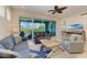 Spacious living room with comfortable seating and access to balcony at 391 Aruba Cir # 302, Bradenton, FL 34209
