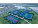 Community tennis and pickleball courts with surrounding green space at 15909 Tradewind Ter, Lakewood Ranch, FL 34211