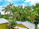 Aerial view showcasing lush tropical landscaping at 44 Tucker Ave, Sarasota, FL 34232