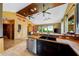 Open kitchen with wood countertops, double sink, and views to living area at 44 Tucker Ave, Sarasota, FL 34232