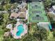 Community overview featuring tennis courts and pool at 154 Inlets Blvd, Nokomis, FL 34275