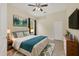 Cozy bedroom with a queen-size bed and modern dresser at 22408 76Th E Ave, Bradenton, FL 34211
