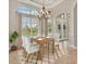 Bright dining room featuring a table with four chairs and large windows at 22408 76Th E Ave, Bradenton, FL 34211