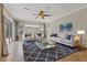 Living room with a large sectional sofa and a patterned rug at 22408 76Th E Ave, Bradenton, FL 34211