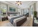 Large main bedroom with a comfortable king-size bed and large windows at 22408 76Th E Ave, Bradenton, FL 34211