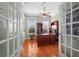 Home office featuring rich wood floors, a large desk, and built-in bookshelves at 239 Fry Se Ter, Port Charlotte, FL 33952