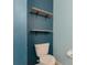 Bathroom with toilet and floating shelves at 5852 Elegant Orchid Way, Sarasota, FL 34232