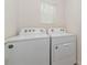 Laundry room with washer and dryer included at 5852 Elegant Orchid Way, Sarasota, FL 34232