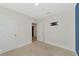 Bedroom with a blue accent wall and access to the bathroom at 5852 Elegant Orchid Way, Sarasota, FL 34232