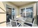 Covered patio with table and chairs, perfect for outdoor dining at 7022 Chatum Light Run, Bradenton, FL 34212