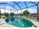 Relaxing screened-in pool and lanai overlooking a peaceful lake at 7022 Chatum Light Run, Bradenton, FL 34212