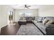 Relaxing living room with large sectional sofa and sliding glass doors at 7022 Chatum Light Run, Bradenton, FL 34212