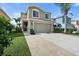 Tan two-story house with attached garage at 7022 Chatum Light Run, Bradenton, FL 34212