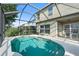 Relaxing pool area with screened enclosure and patio furniture at 7022 Chatum Light Run, Bradenton, FL 34212