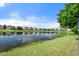 Peaceful lake view with reflections of homes at 7022 Chatum Light Run, Bradenton, FL 34212