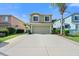 Two-story house with attached garage and landscaped yard at 7022 Chatum Light Run, Bradenton, FL 34212