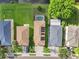 Aerial view of houses with solar panels and lush green lawns at 7022 Chatum Light Run, Bradenton, FL 34212