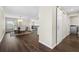 Dining area with dark hardwood floors and sliding barn door at 7022 Chatum Light Run, Bradenton, FL 34212