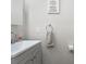 Small bathroom with gray vanity and white sink at 7022 Chatum Light Run, Bradenton, FL 34212