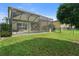 Backyard with screened-in pool and fenced area at 7022 Chatum Light Run, Bradenton, FL 34212