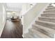 Staircase with carpeted steps and dark hardwood floors at 7022 Chatum Light Run, Bradenton, FL 34212