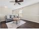 Upstairs living room with dark hardwood floors and ceiling fan at 7022 Chatum Light Run, Bradenton, FL 34212