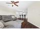 Open living room with view into kitchen and breakfast bar at 7022 Chatum Light Run, Bradenton, FL 34212