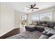 Spacious living area featuring sectional sofa and access to patio at 7022 Chatum Light Run, Bradenton, FL 34212