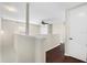 Upstairs hallway with dark hardwood floors and neutral walls at 7022 Chatum Light Run, Bradenton, FL 34212