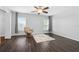 Upstairs bedroom with dark hardwood floors and ceiling fan at 7022 Chatum Light Run, Bradenton, FL 34212