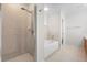 Bathroom with shower, bathtub, and double vanity at 7022 Chatum Light Run, Bradenton, FL 34212
