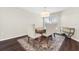 Bright dining room with wood table and seating for four at 7022 Chatum Light Run, Bradenton, FL 34212
