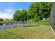 Backyard with a fenced area and lake view at 7022 Chatum Light Run, Bradenton, FL 34212