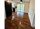 Dining room with wood-look tile floor and access to patio at 20437 Midway Blvd, Port Charlotte, FL 33952