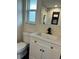 Modern bathroom with white vanity and marble shower at 20437 Midway Blvd, Port Charlotte, FL 33952
