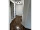 Long hallway with dark wood-look flooring at 20437 Midway Blvd, Port Charlotte, FL 33952
