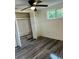 Spacious bedroom with large closet and wood-look flooring at 20437 Midway Blvd, Port Charlotte, FL 33952
