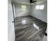 Spacious bedroom with wood-look tile flooring at 20437 Midway Blvd, Port Charlotte, FL 33952