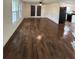 Living room featuring dark brown wood-look tile flooring at 20437 Midway Blvd, Port Charlotte, FL 33952