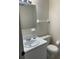 Clean bathroom with toilet, sink, and vanity at 20437 Midway Blvd, Port Charlotte, FL 33952