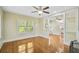 Open living room with hardwood floors and built-in shelving at 1677 4Th St, Sarasota, FL 34236